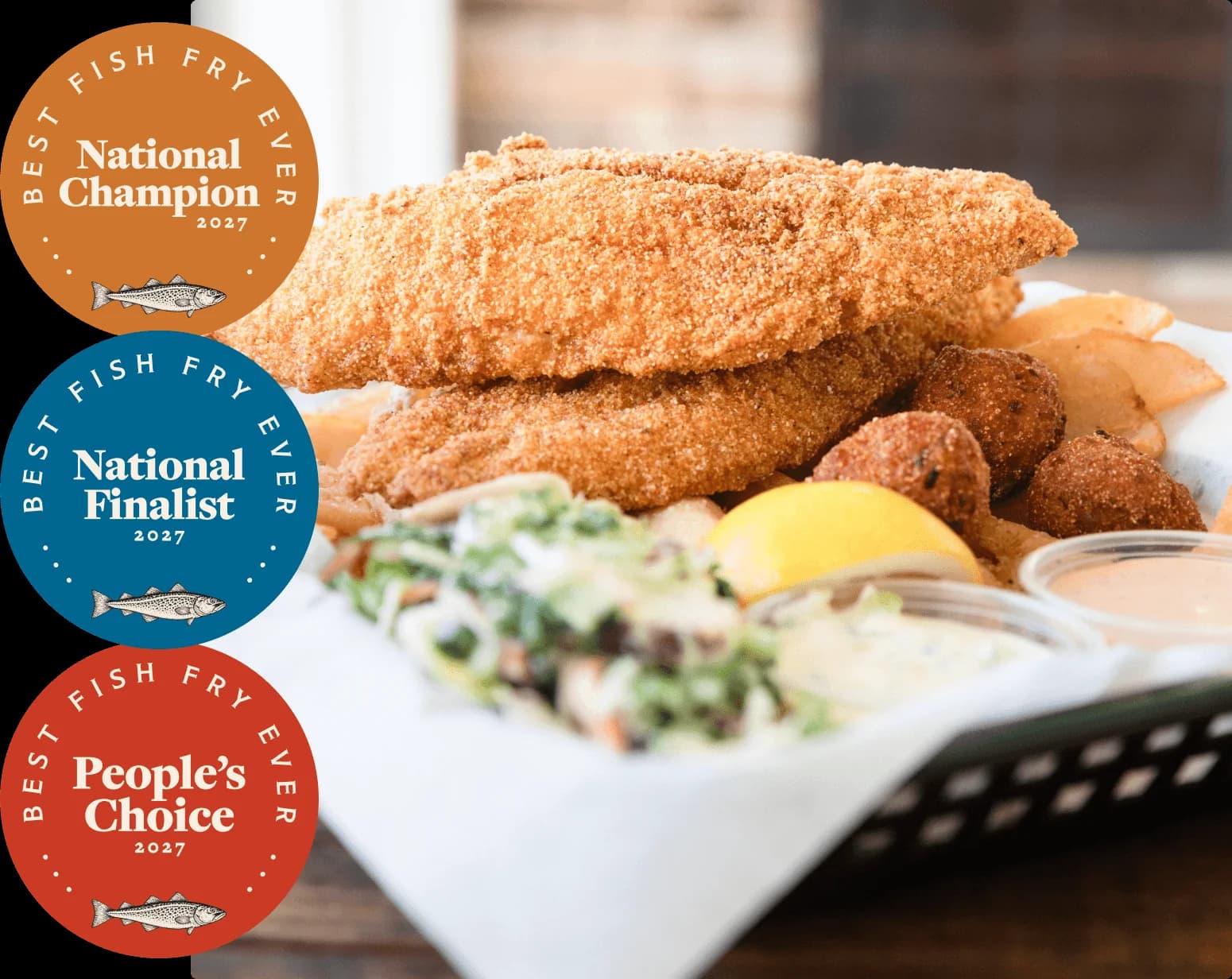 The three Best Fish Fry Ever 2027 badges, National Champion, National Finalist and People's Choice, beside a basket of fried fish